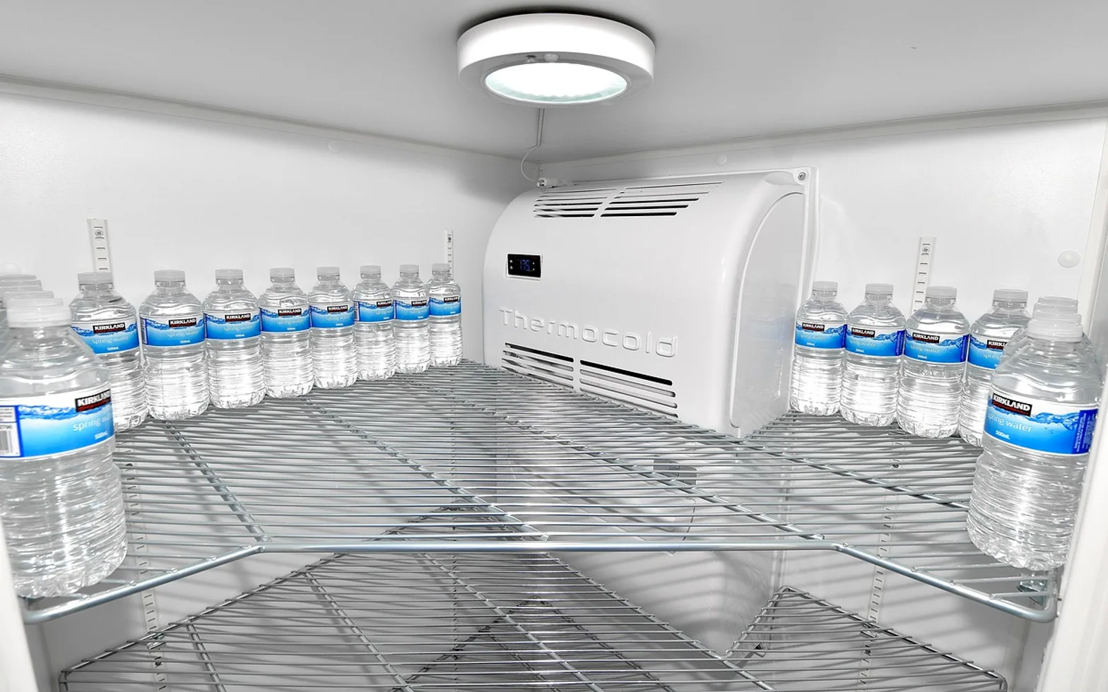 Water bottle, empty fridge and fridge